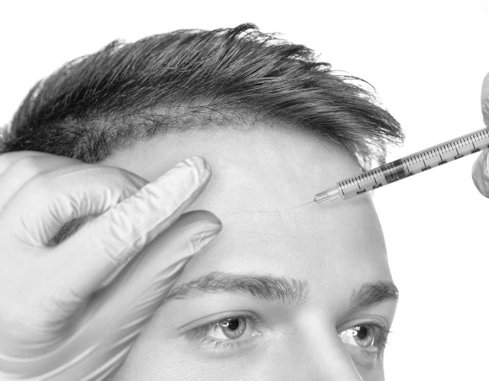 man injected on forehead